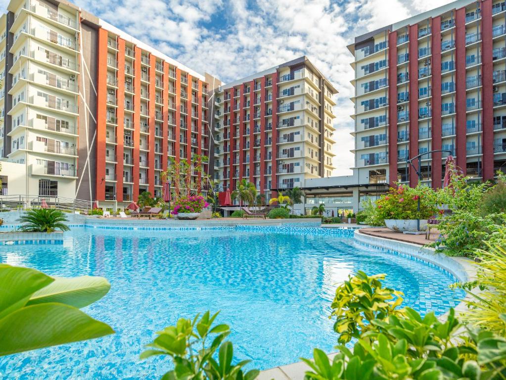 Actual swimming pool and residential buildings at Primeworld District