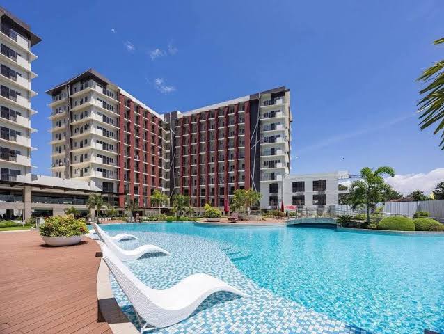 Actual swimming pool and residential buildings at Primeworld District